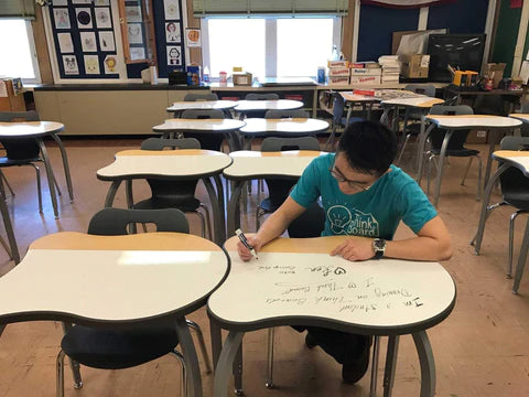 someone using a Think Board desk 