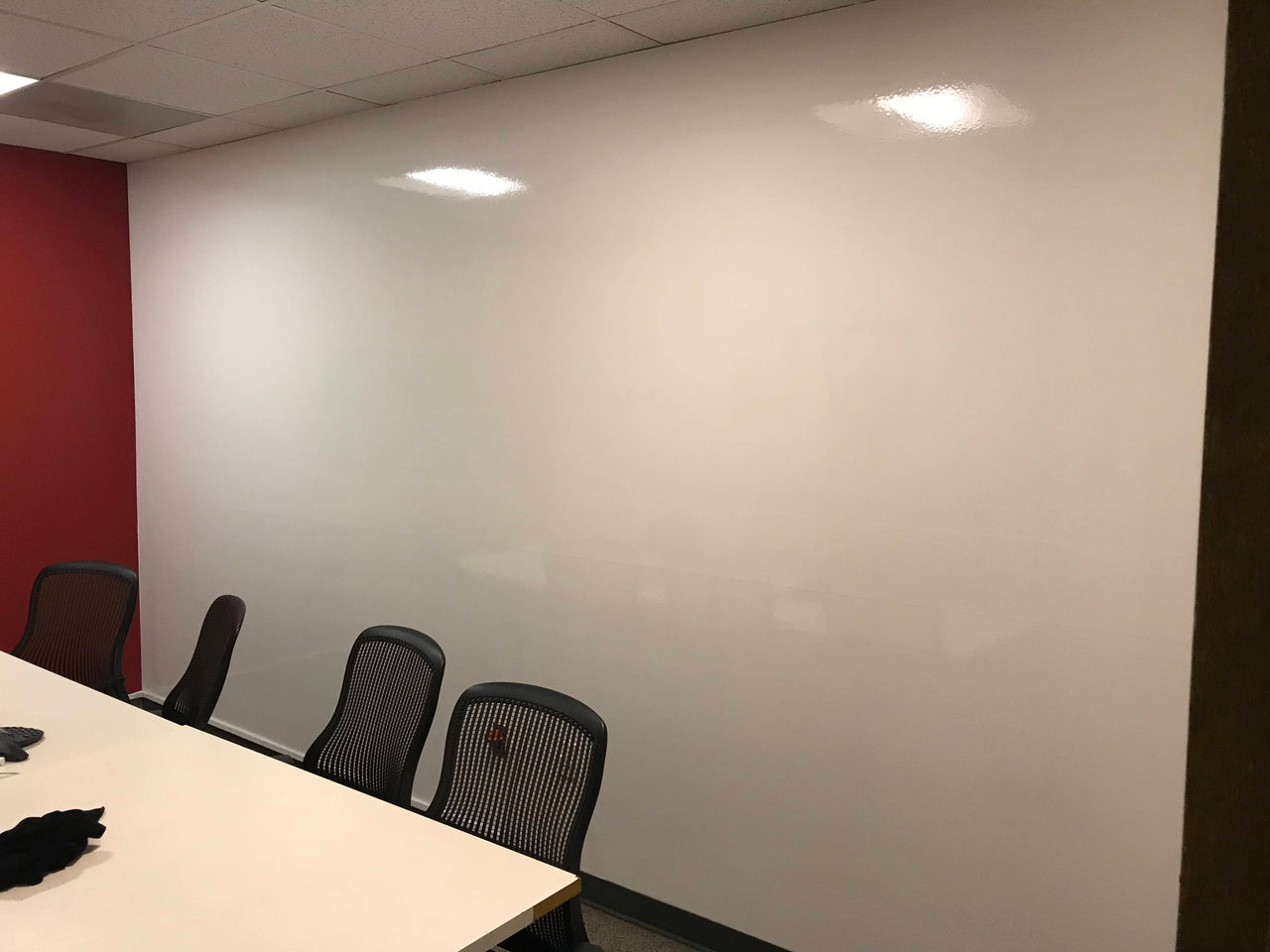 Floor to ceiling custom whiteboard wall
